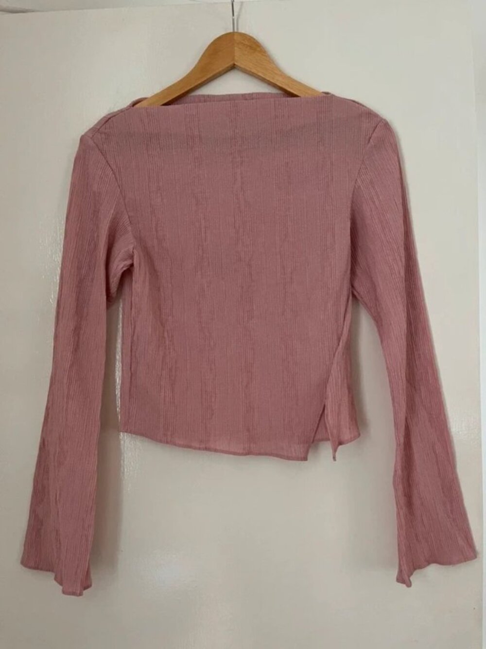 pink top with flared sleeves